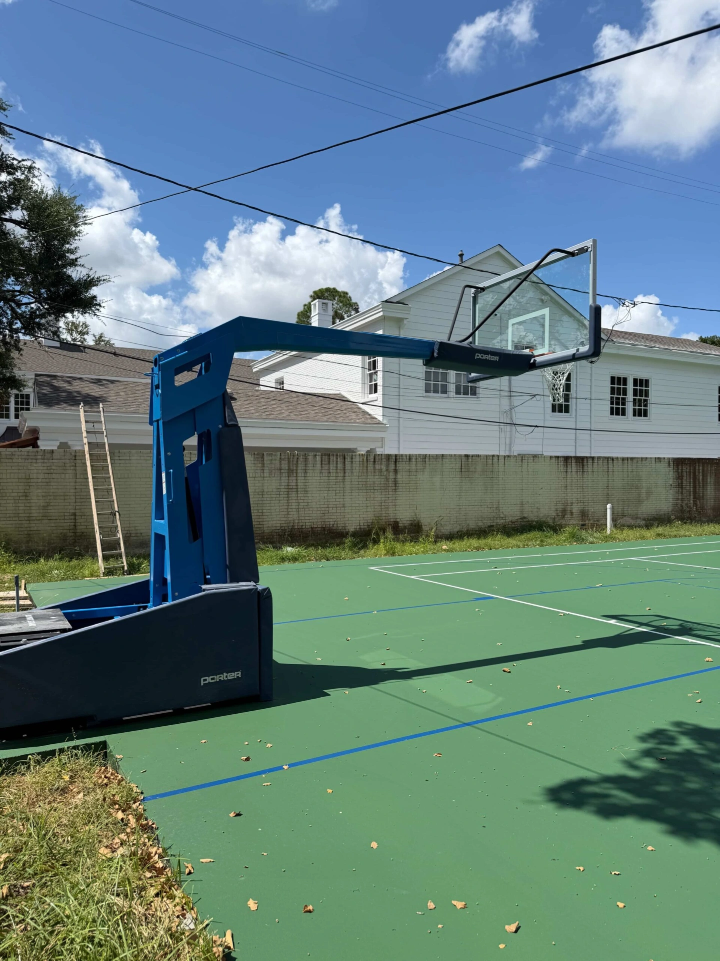 houston-backyard-tennis-court-with-basketball-lines-resurfacing-scaled (1)