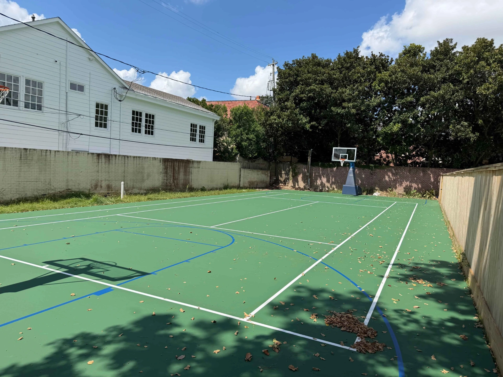 residential-tennis-court-resurfacing-houston-two-basketball-hoops-scaled