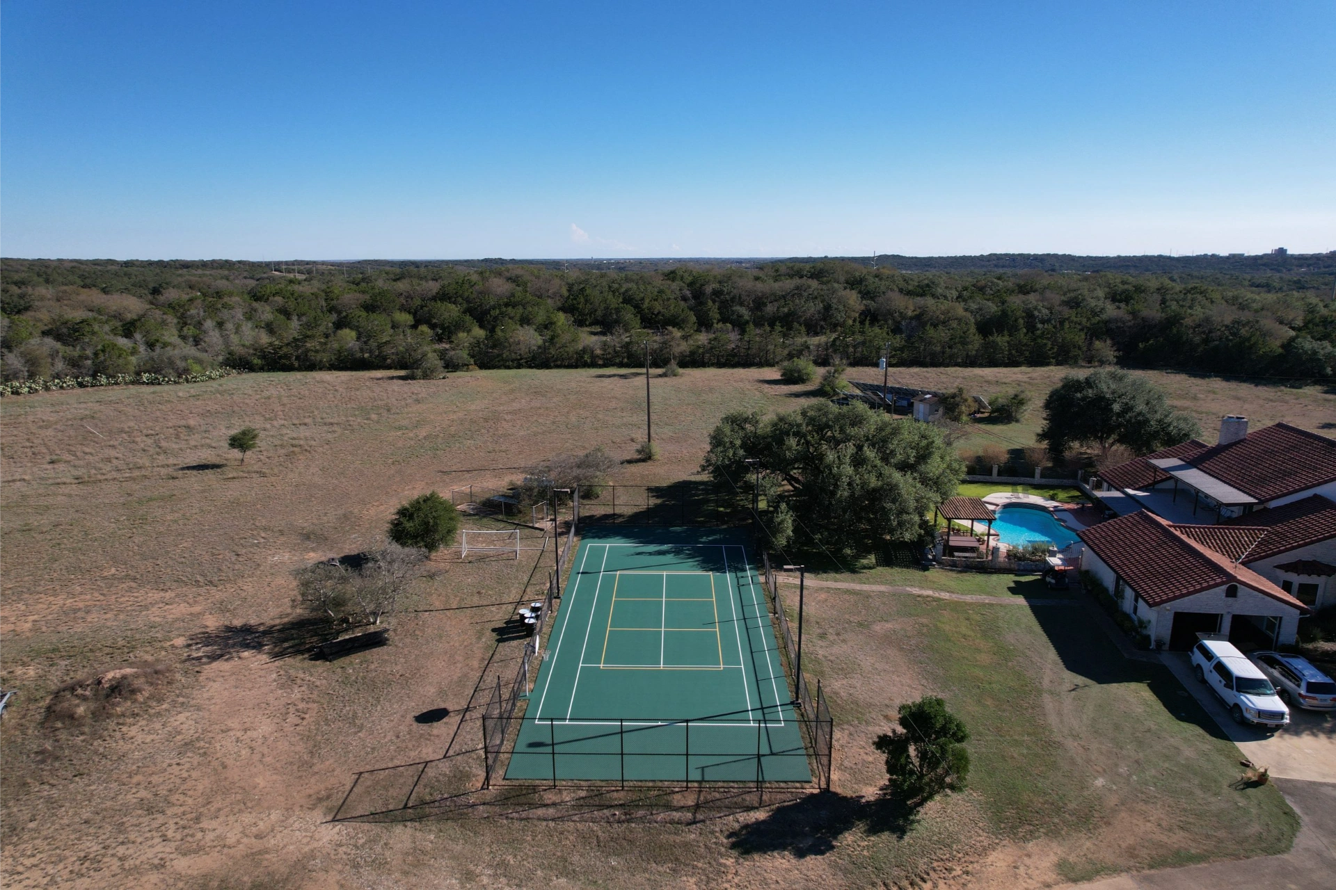 tennis-court-resurfacing-backyard-aerial-view-scaled